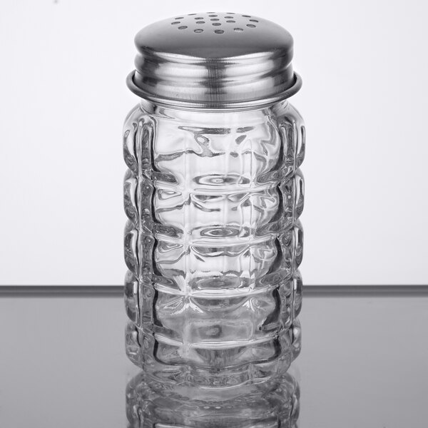 A Tablecraft Nostalgia glass salt shaker with a stainless steel top.