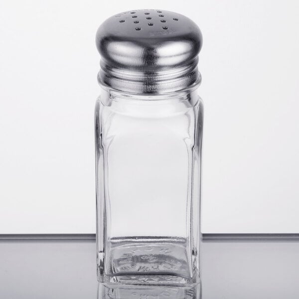 A clear glass TableCraft salt shaker with a metal lid.