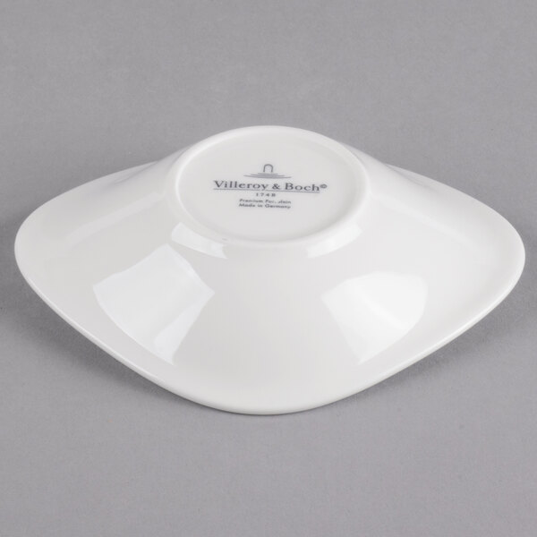 A white Villeroy & Boch porcelain flat bowl with a white rim.