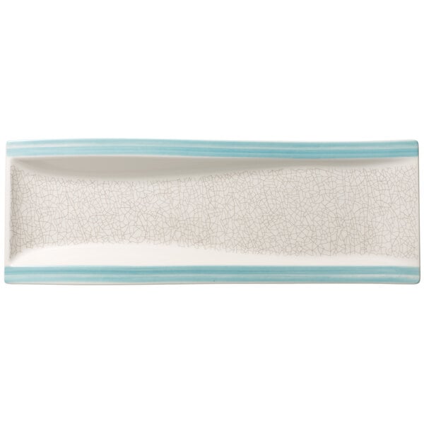 A rectangular aquamarine porcelain plate with a crackle pattern on the rim.