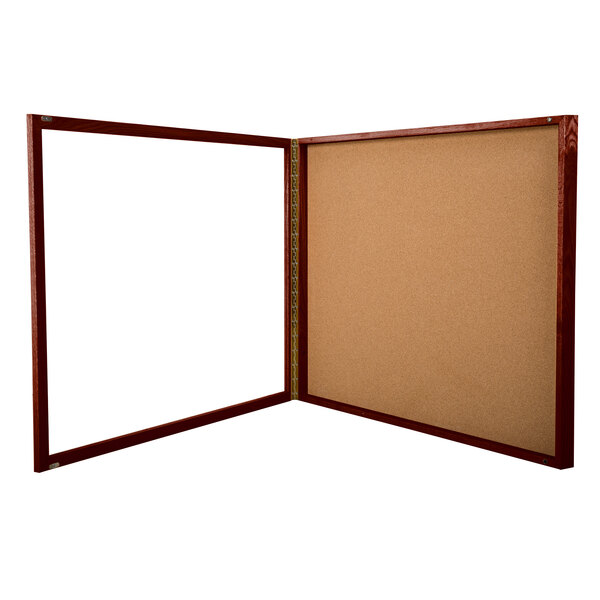 A wooden Aarco cherry finish display case with a cork board and glass panel.