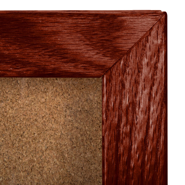 An Aarco enclosed hinged display case with a cork board inside.