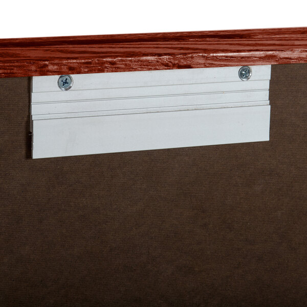 A white board with a wood frame.