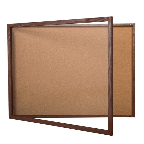 A brown wooden enclosed display case with a glass door.