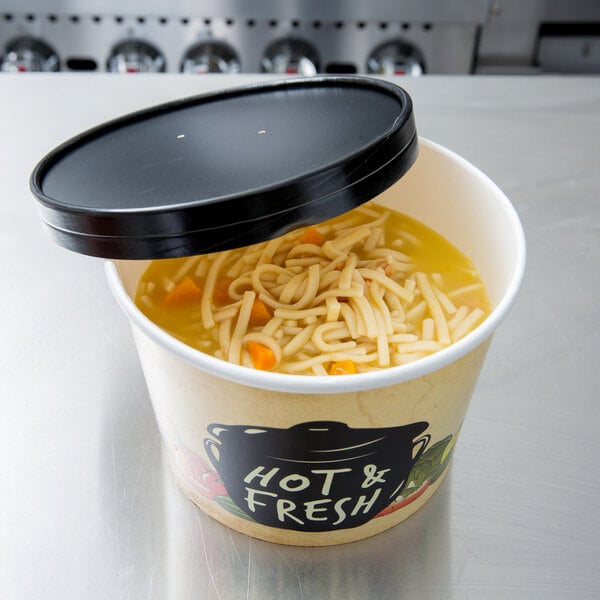 A white Choice paper soup cup filled with noodles and broth with a vented paper lid.