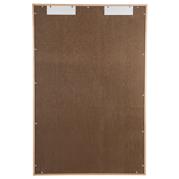 A brown board with two metal clips on it.