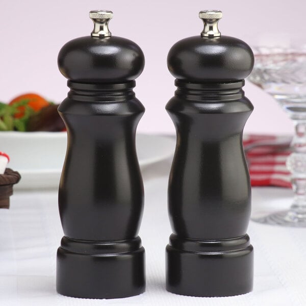 Two black pepper mills with a Salem ebony finish.