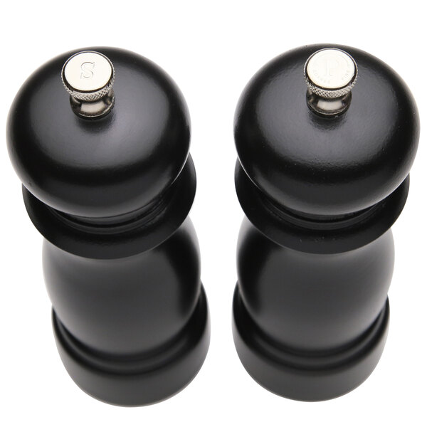 A black pepper mill and salt mill set with a silver tip.