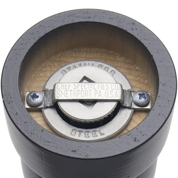 A close up of a Chef Specialties Salem Ebony pepper and salt mill grinder with a screw.
