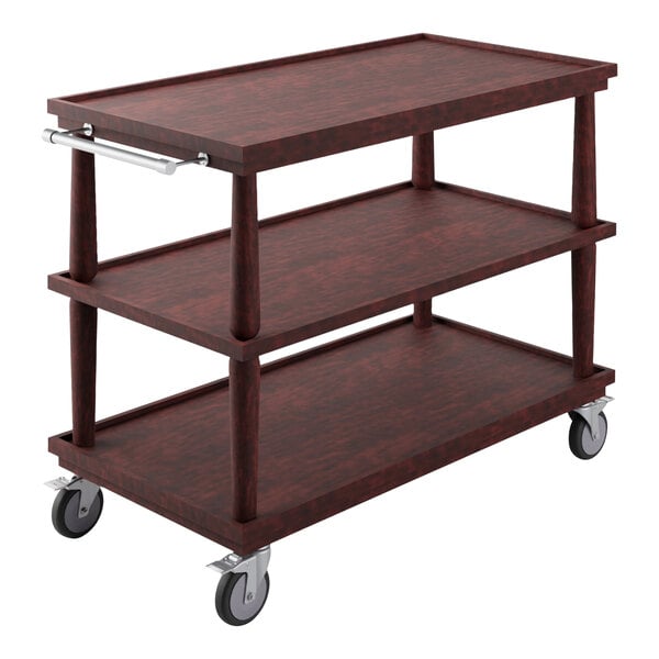 A Bon Chef Classic Mahogany Guerridon Trolley with brown wood shelves on wheels.