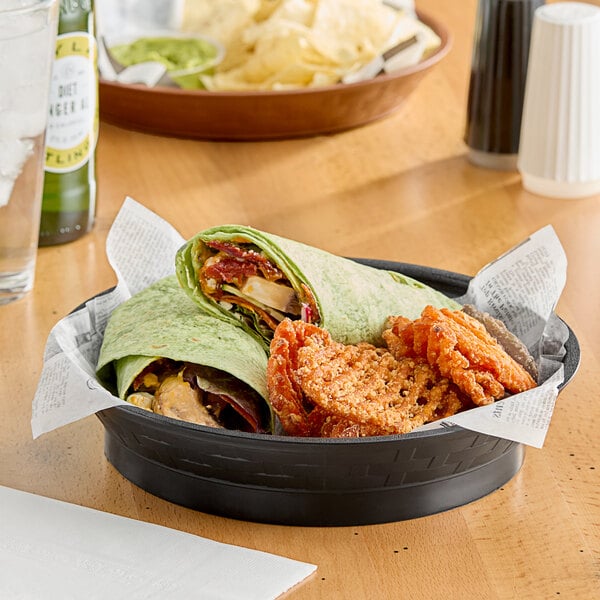 A black plastic Choice diner platter with food on it on a table.