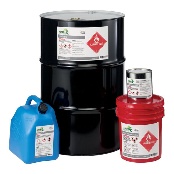 Four chemical containers of different sizes and colors, each with a white label featuring hazard symbols and warnings, including a prominent red flammable liquid symbol.