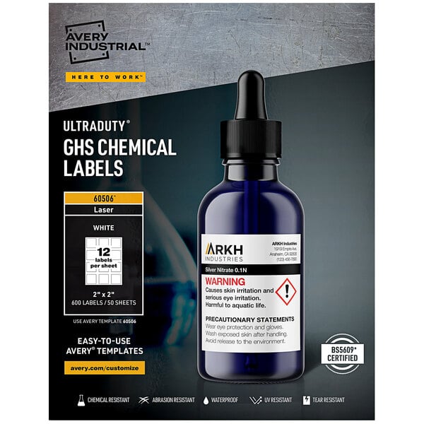 A package of Avery UltraDuty GHS Chemical Labels on a counter with a bottle.