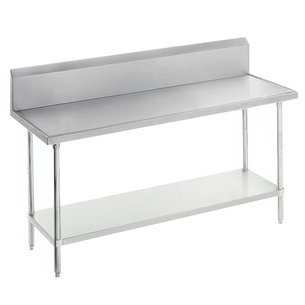 An Advance Tabco stainless steel work table with backsplash, undershelf, and galvanized legs.