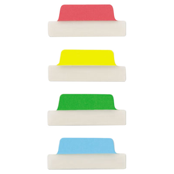 A white surface with green, yellow, and red rectangular Avery Ultra Tabs.