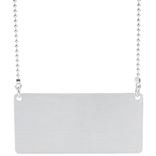 a silver rectangular sign with a chain