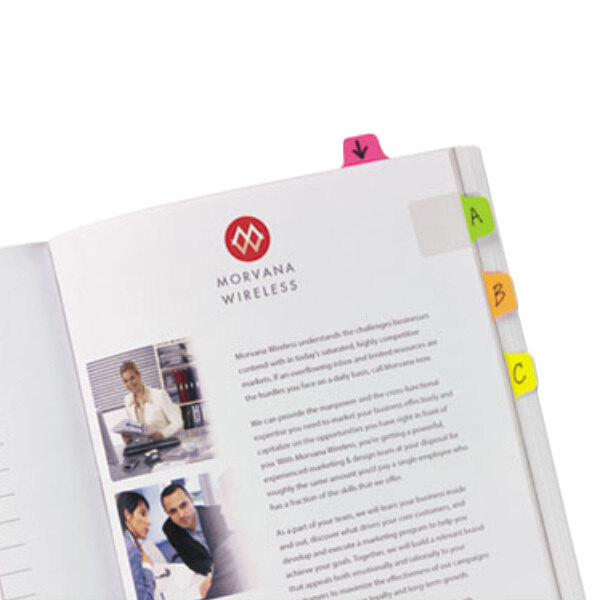A book with Avery Ultra Tabs in assorted neon colors attached to it.