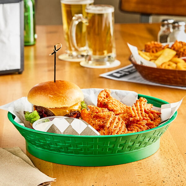 A green plastic diner platter with food in it on a table.