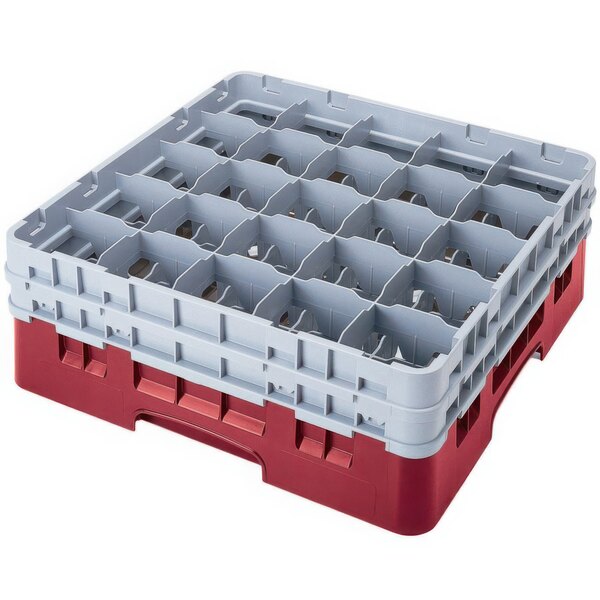 A red and white plastic Cambro glass rack with many compartments and extenders.