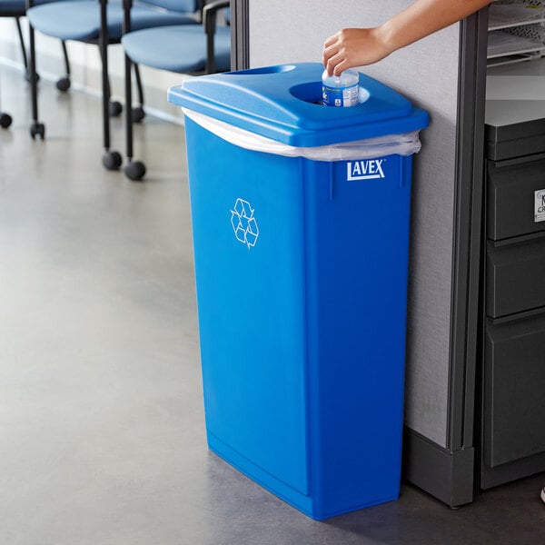 placing a water bottle in a recycling bin