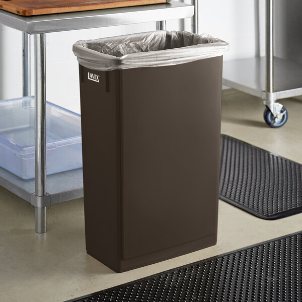 A brown rectangular Lavex trash can with a lid.