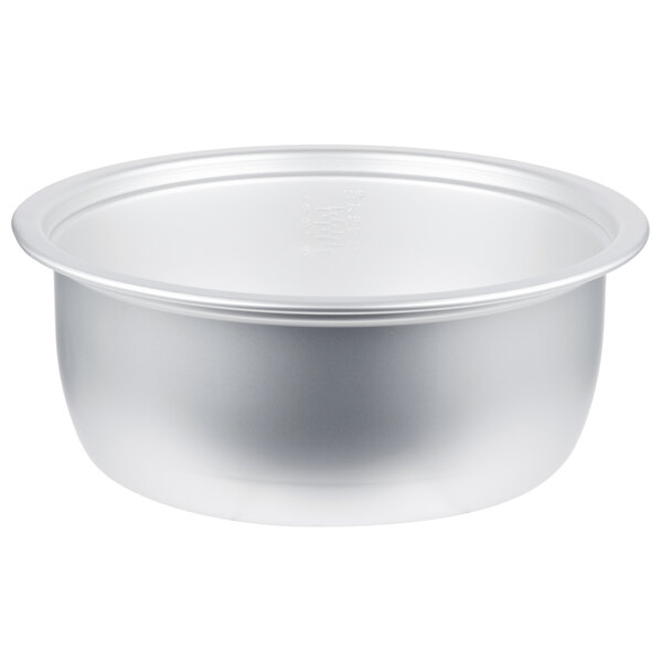 A close-up of a silver bowl with text on it.