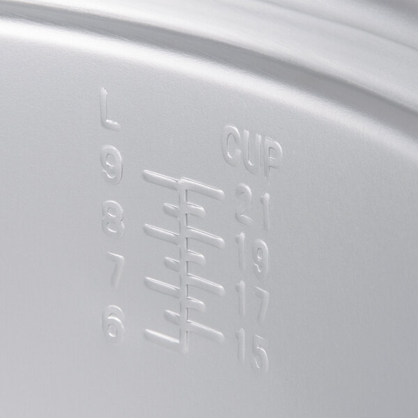 A white Town rice cooker pot with a lid.