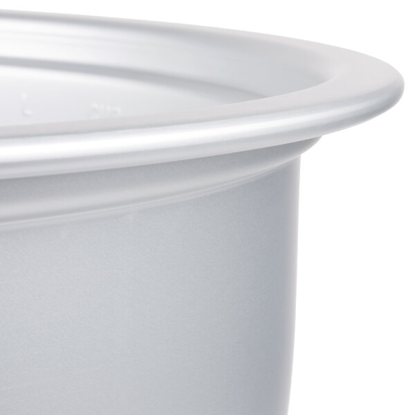 A silver rice cooker pot with a lid.