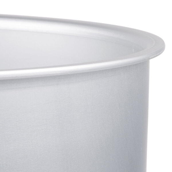 A close-up of a metal pot with a lid.