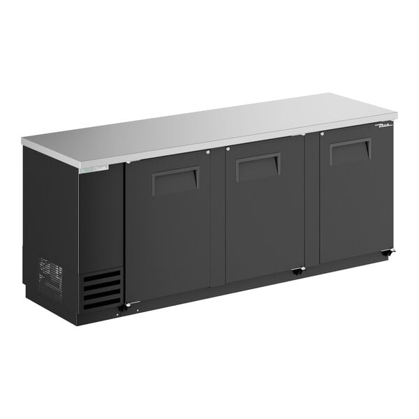 A black True back bar refrigerator with solid doors.