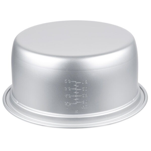 A silver bowl with a silver rice cooker pot lid.