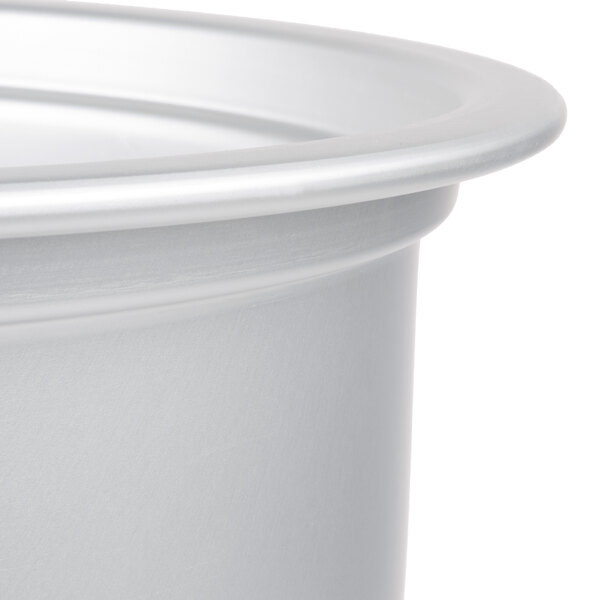 A silver metal pot with a white lid.