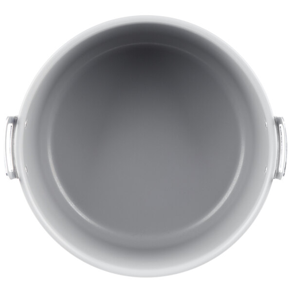 A grey Teflon-coated aluminum pot with a handle on top.