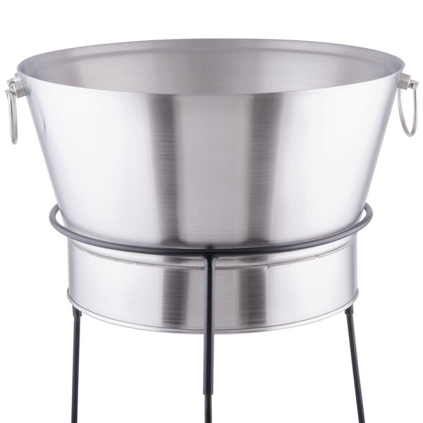 A Tablecraft brushed stainless steel beverage tub on a black stand.