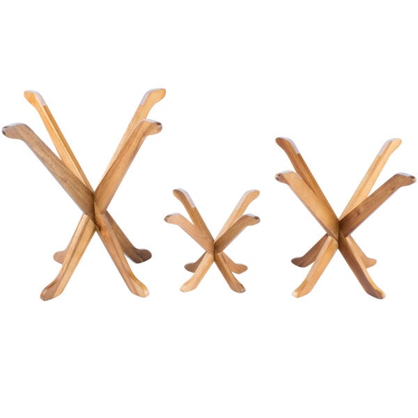 A group of wooden x-shaped Tablecraft display stands.