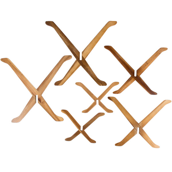 A group of wooden x shaped objects with legs.