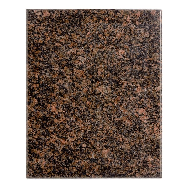 A close-up of a tan brown granite Art Marble Furniture table top with black and brown spots.