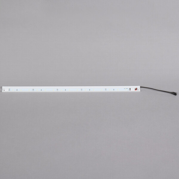 An Avantco LED rectangular light bar with a black wire.