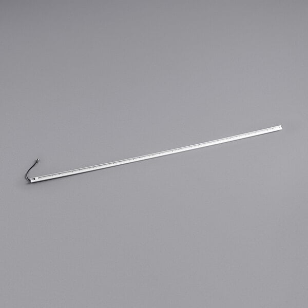 A white metal rod with a long white ruler on a gray background.