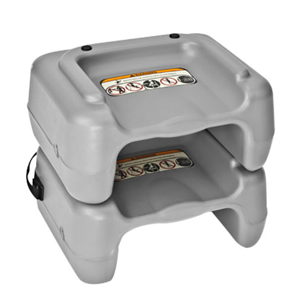Two gray plastic Koala Kare booster seats with safety straps on a table.