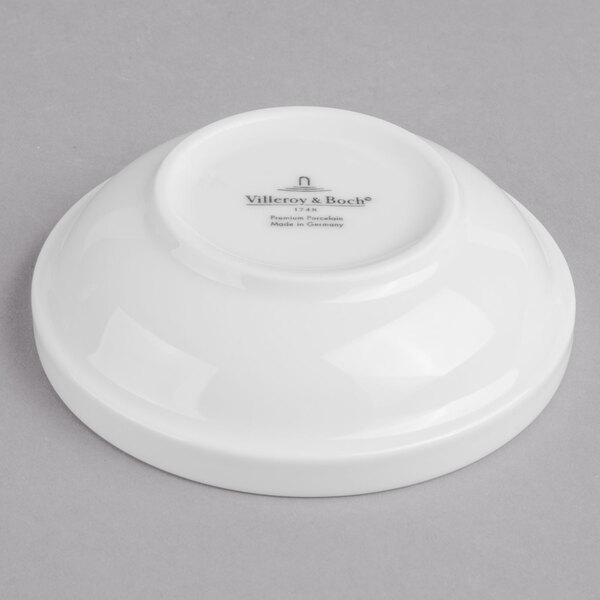 A Villeroy & Boch white porcelain bowl with black text on it.