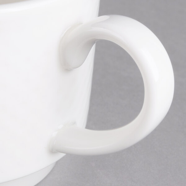 A Villeroy & Boch white porcelain stackable mug with a handle.