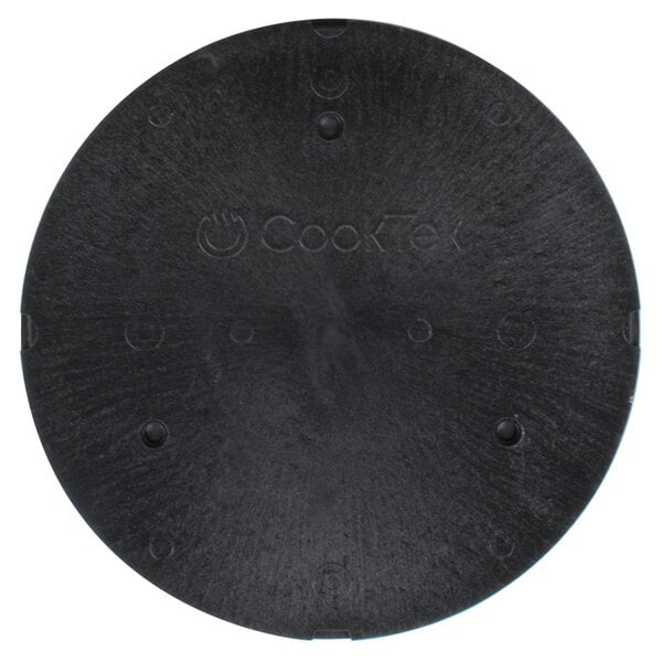 A black circular object with holes.