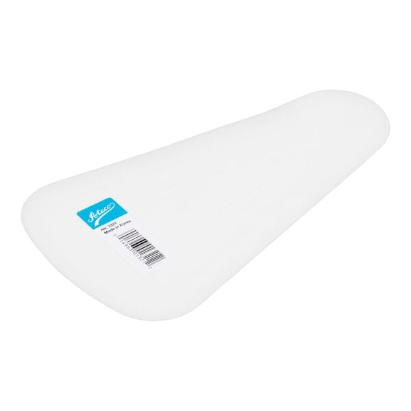 A white, triangular plastic scraper with a barcode sticker and a blue label on one side.
