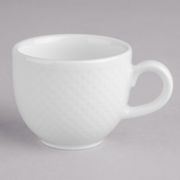 A white porcelain cup with a handle.