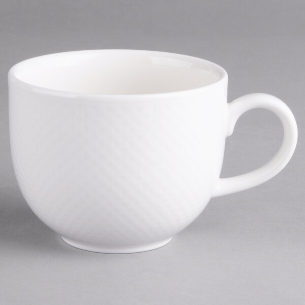 A Villeroy & Boch white porcelain cup with a handle.