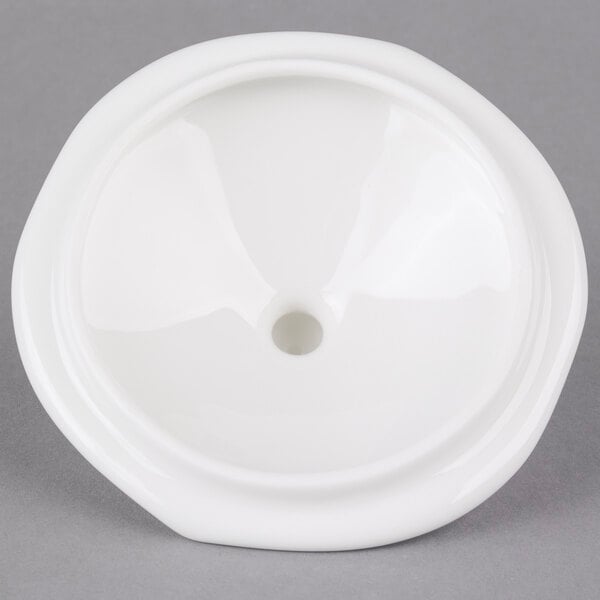 The lid for a white Villeroy & Boch porcelain sugar bowl with a hole in the top.