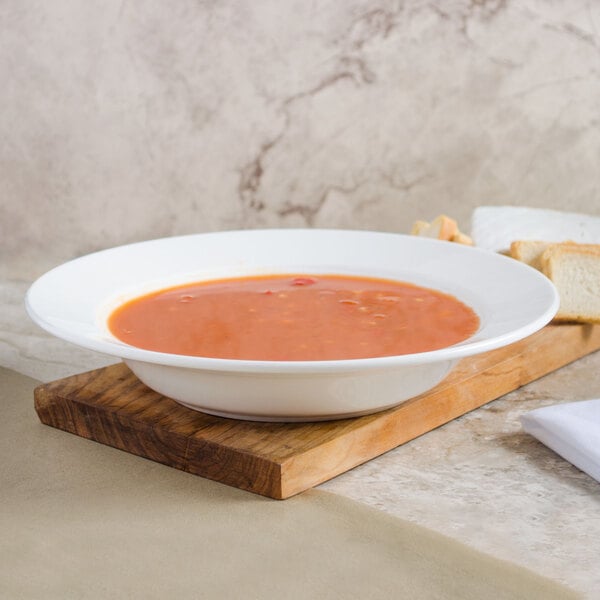 A bowl of soup on a table.