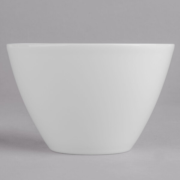 A white bowl on a gray background.