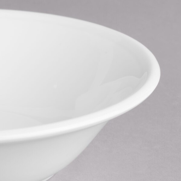 A close-up of a Villeroy & Boch white porcelain bowl with a white rim.